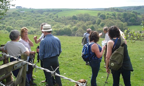 A welcome break as the group enjoy views over the Iron Mill Stream valley