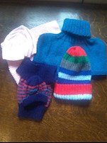 An array of knitted hats and mittens made by the Coldridge Knit & Natter Club_23 Jul 2021