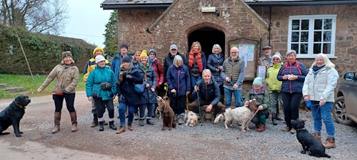 After they've enjoyed coffee, the group pose for a photo outside the Parish Hall ready to set off on their walk