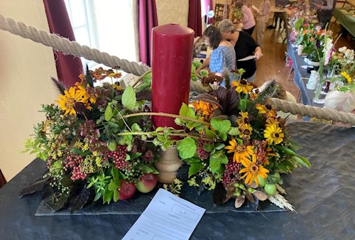 Flower arrangement with a candlestick