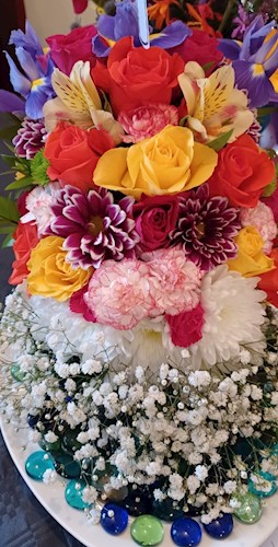 Floral arrangement with fabulous splash of colour