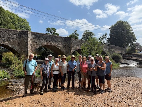 The walking group below the bridge in Culmstock